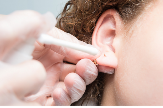 Properly sanitized tools and a clean studio setup are key considerations for maintaining piercing hygiene and safety.