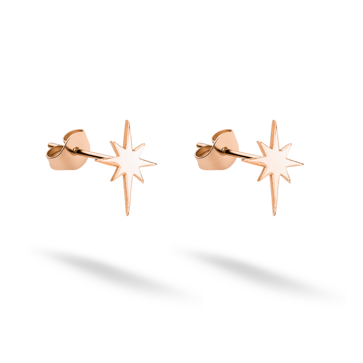 Compass north star earrings rendered in soft 14K rose gold as a coordinated pair