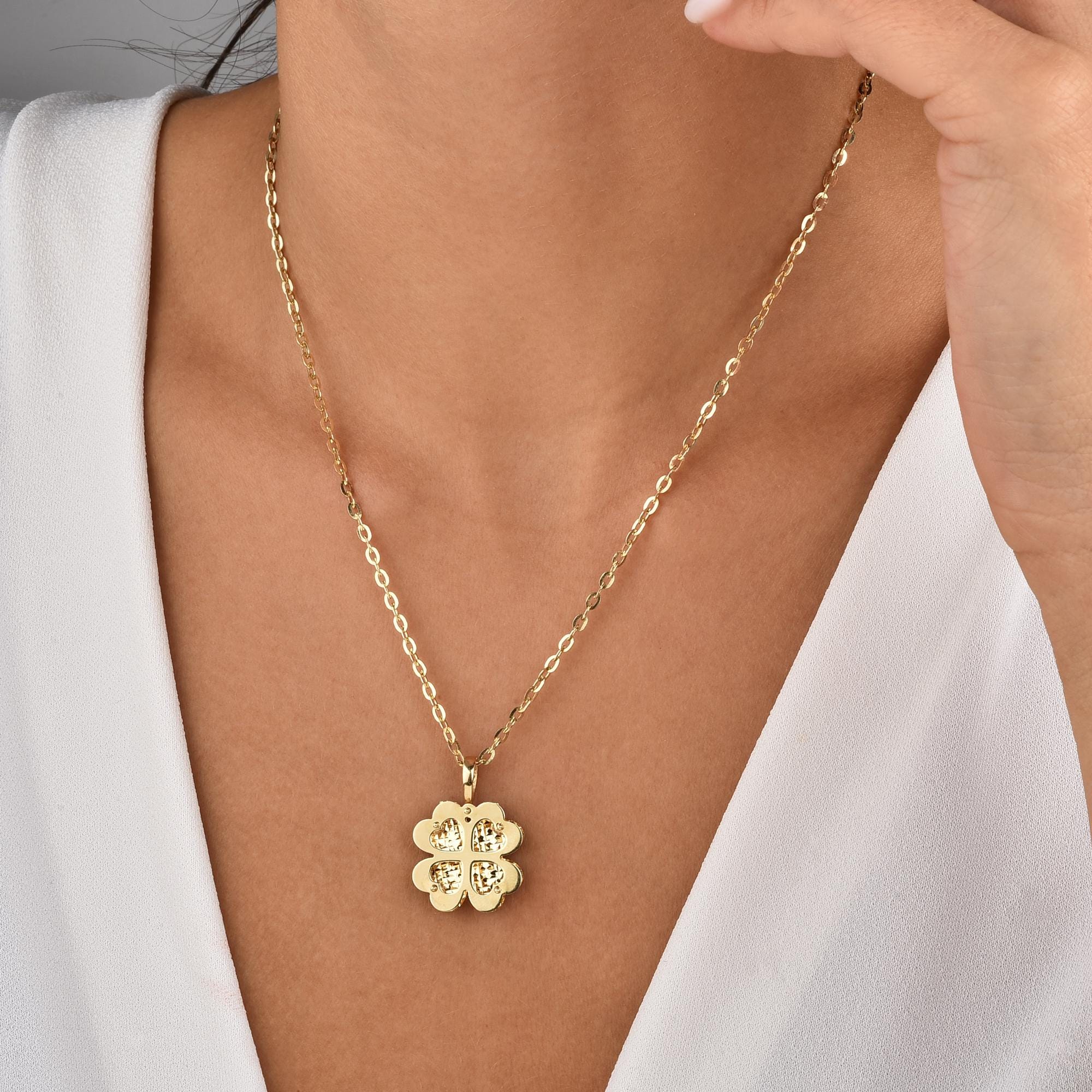 Model wearing the Four Leaf Clover necklace, reflecting its delicate and meaningful charm.