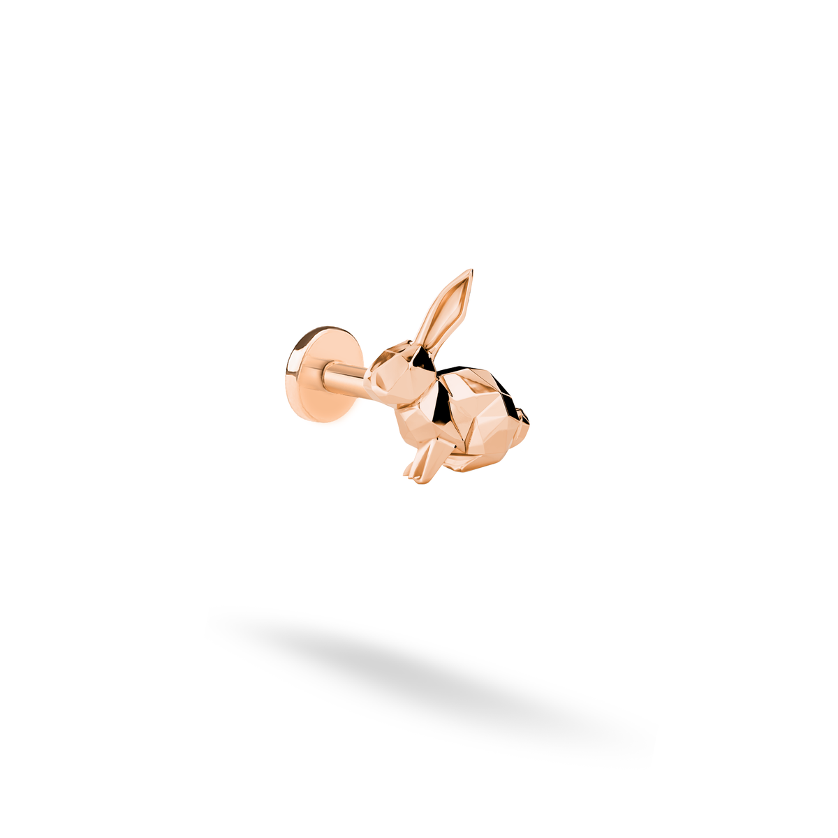Rose gold adds a gentle copper-pink glow to the angular rabbit motif and its upright ears.