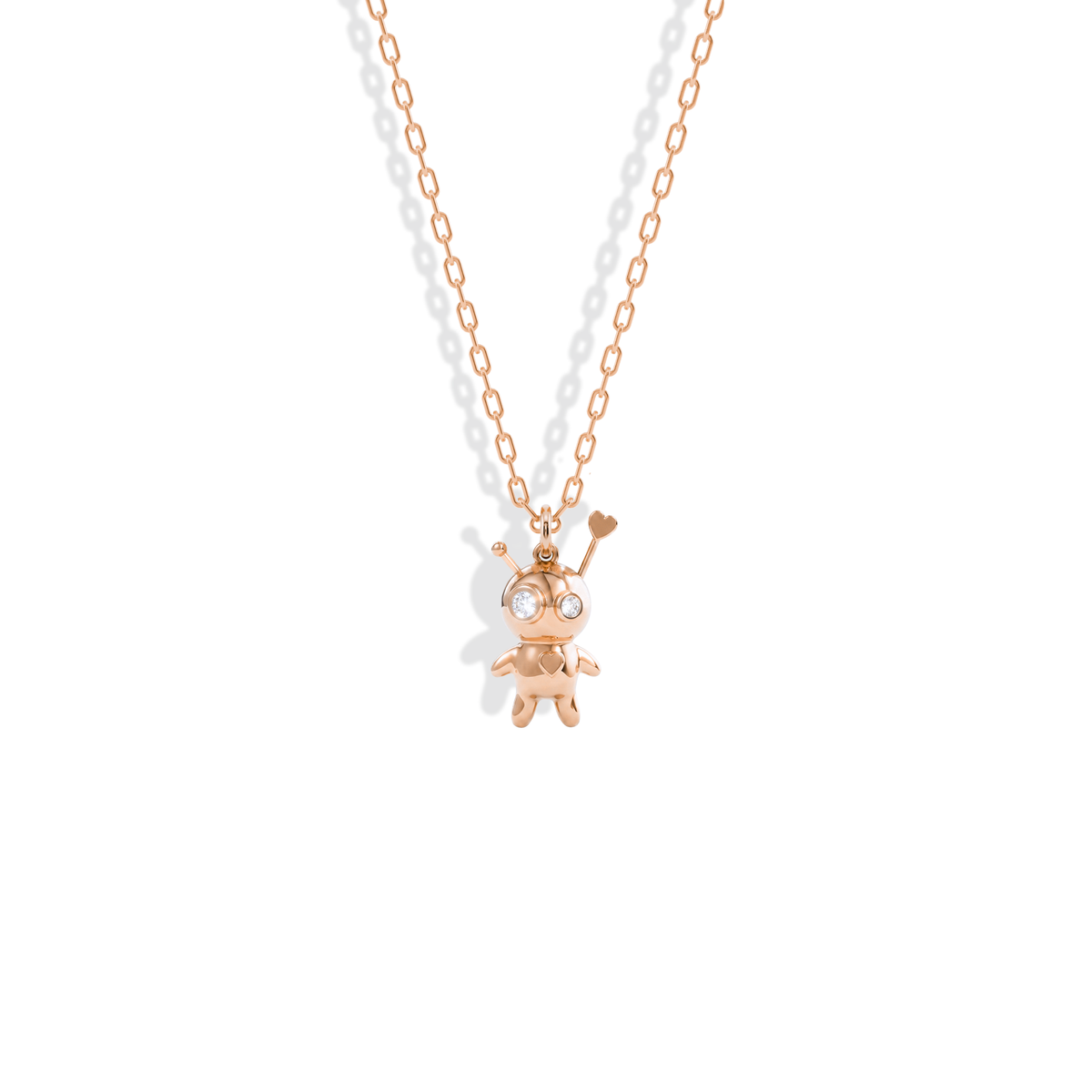 Rose gold voodoo doll talisman, stitches and stone heart in warm pink 14K gold