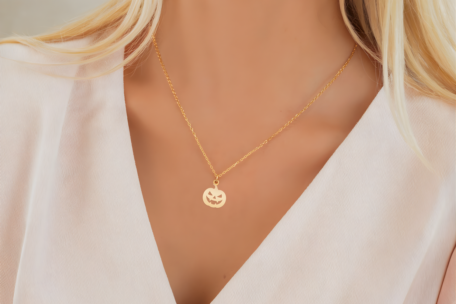 14K gold earrings and piercings styled for a chic Halloween look