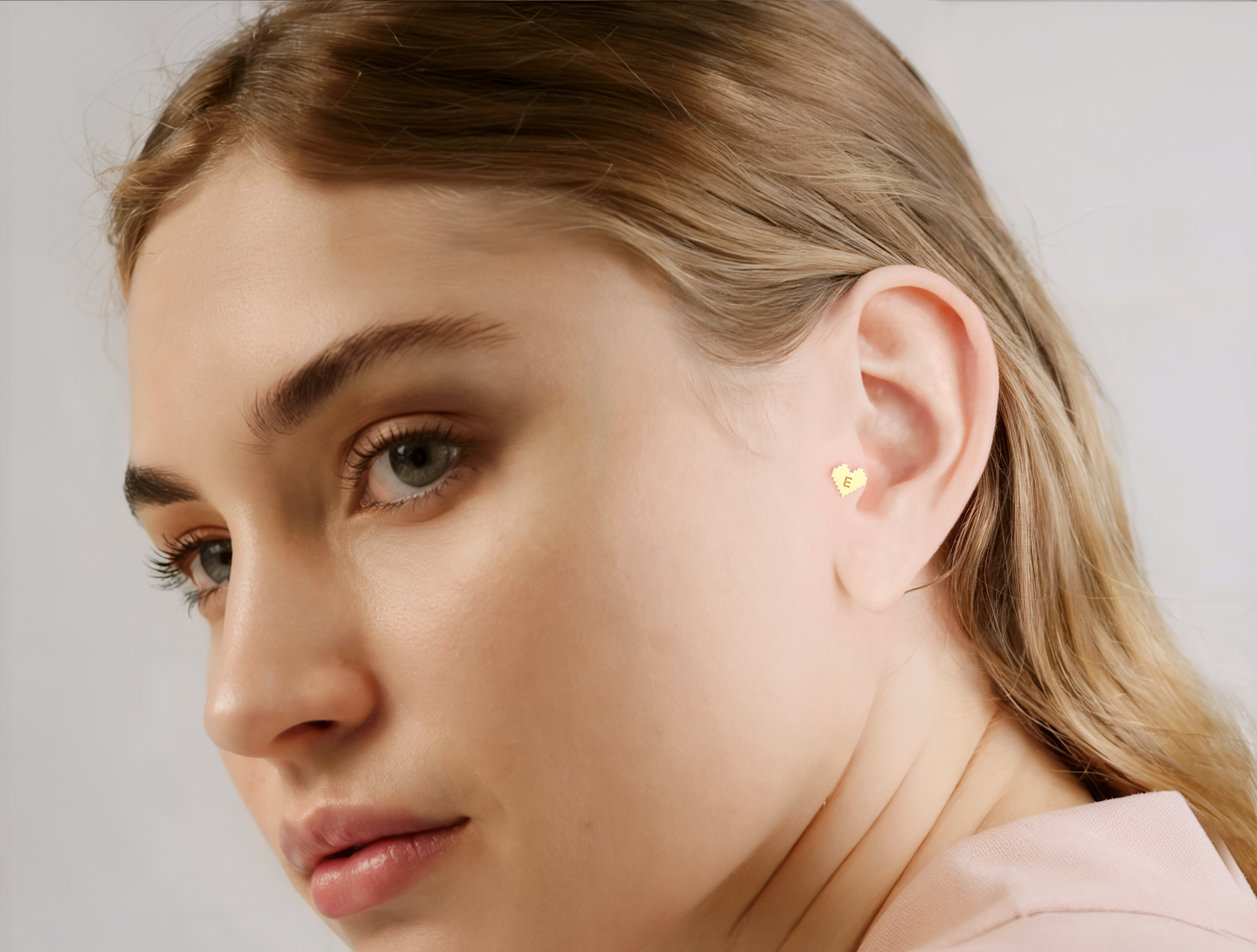 14K solid gold personalized piercing collection with initials, zodiac, and number designs