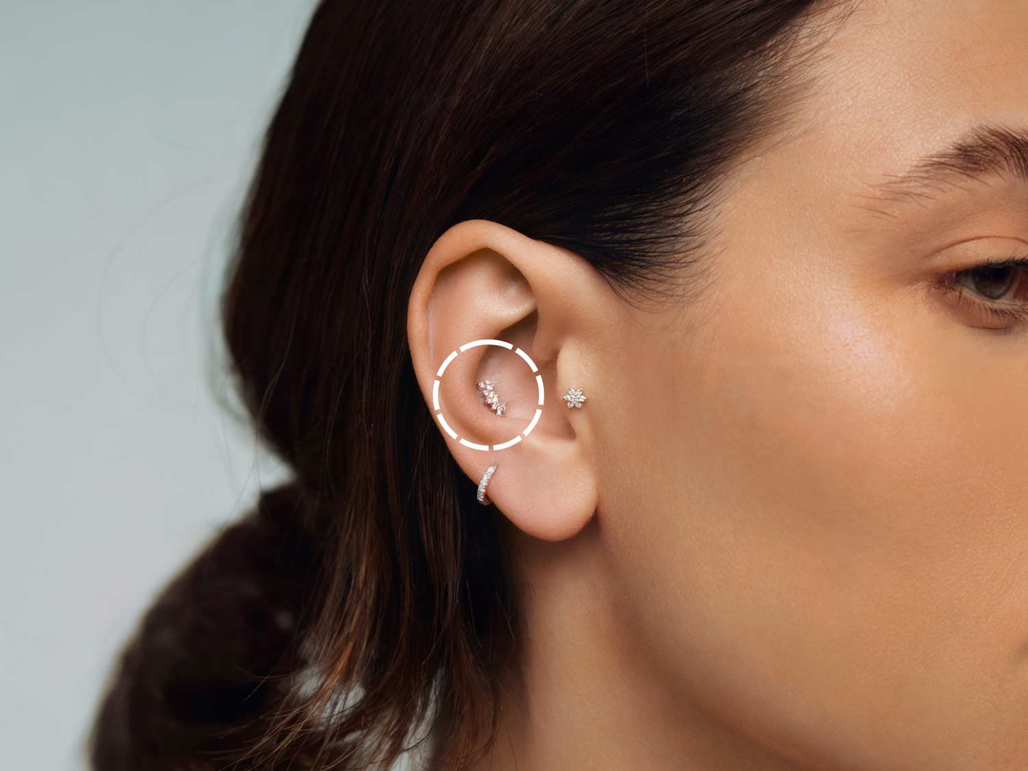 Conch Piercing: A distinctive ear adornment set in the natural shell, showcasing artistic design and intricate detail.