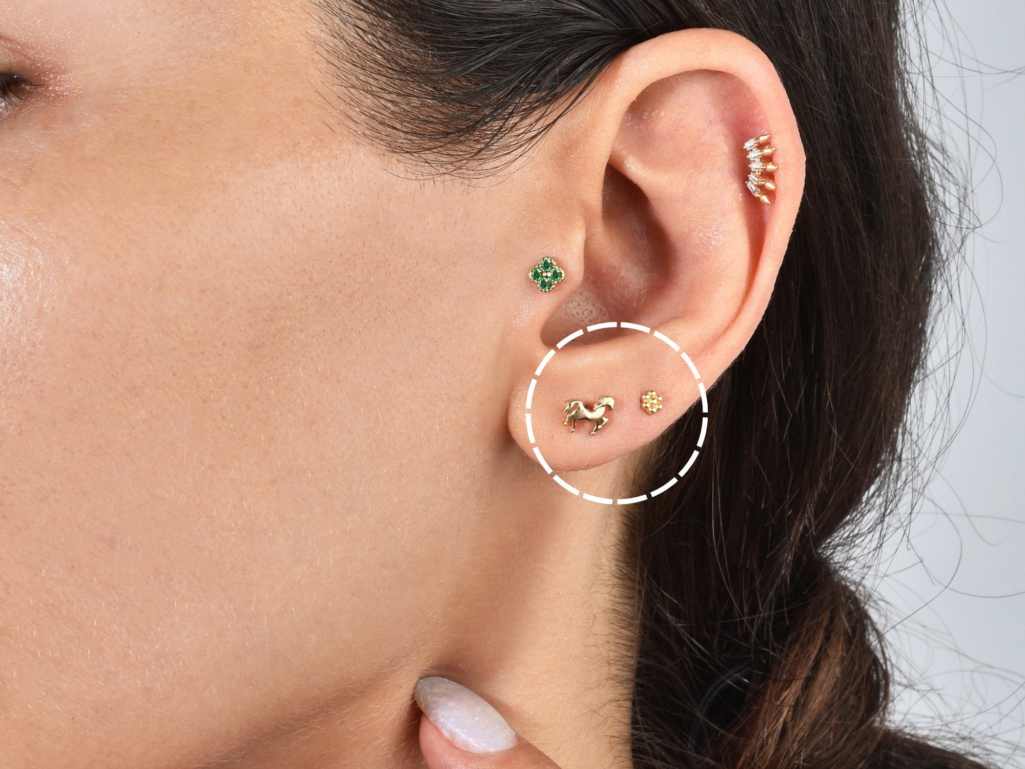 Lobe Piercing: A delicate adornment on the soft earlobe, exemplifying classic beauty and refined design.