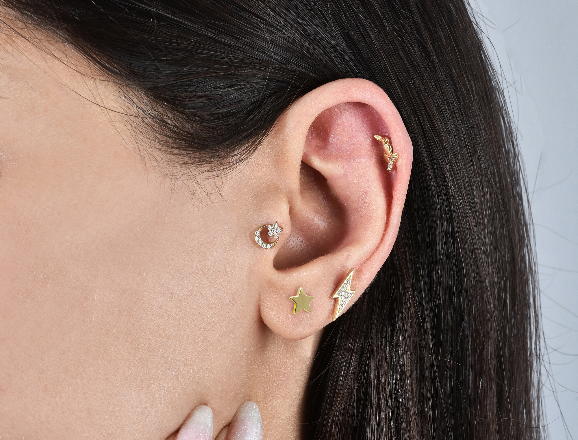 14K gold star moon ear piercings celestial designs lightning sun shapes