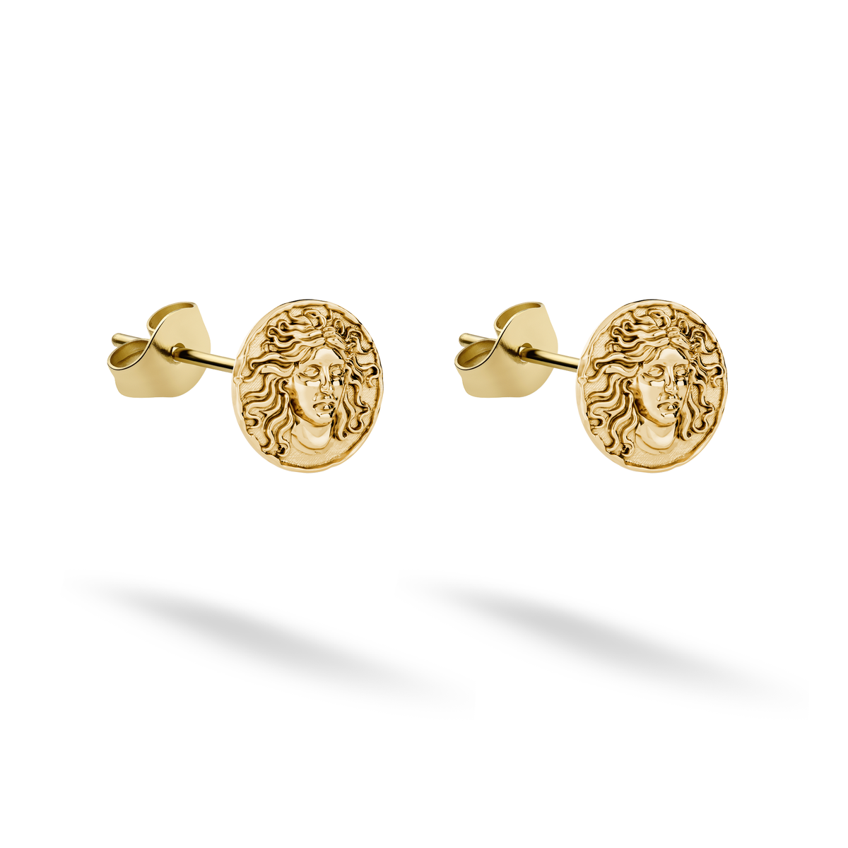 Medusa stud earrings cast in 14K yellow gold display a detailed face framed by curling hair