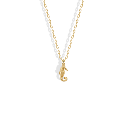 Textured seahorse charm in yellow gold with a curled tail, the Seahorse Pendant Necklace 14K Gold