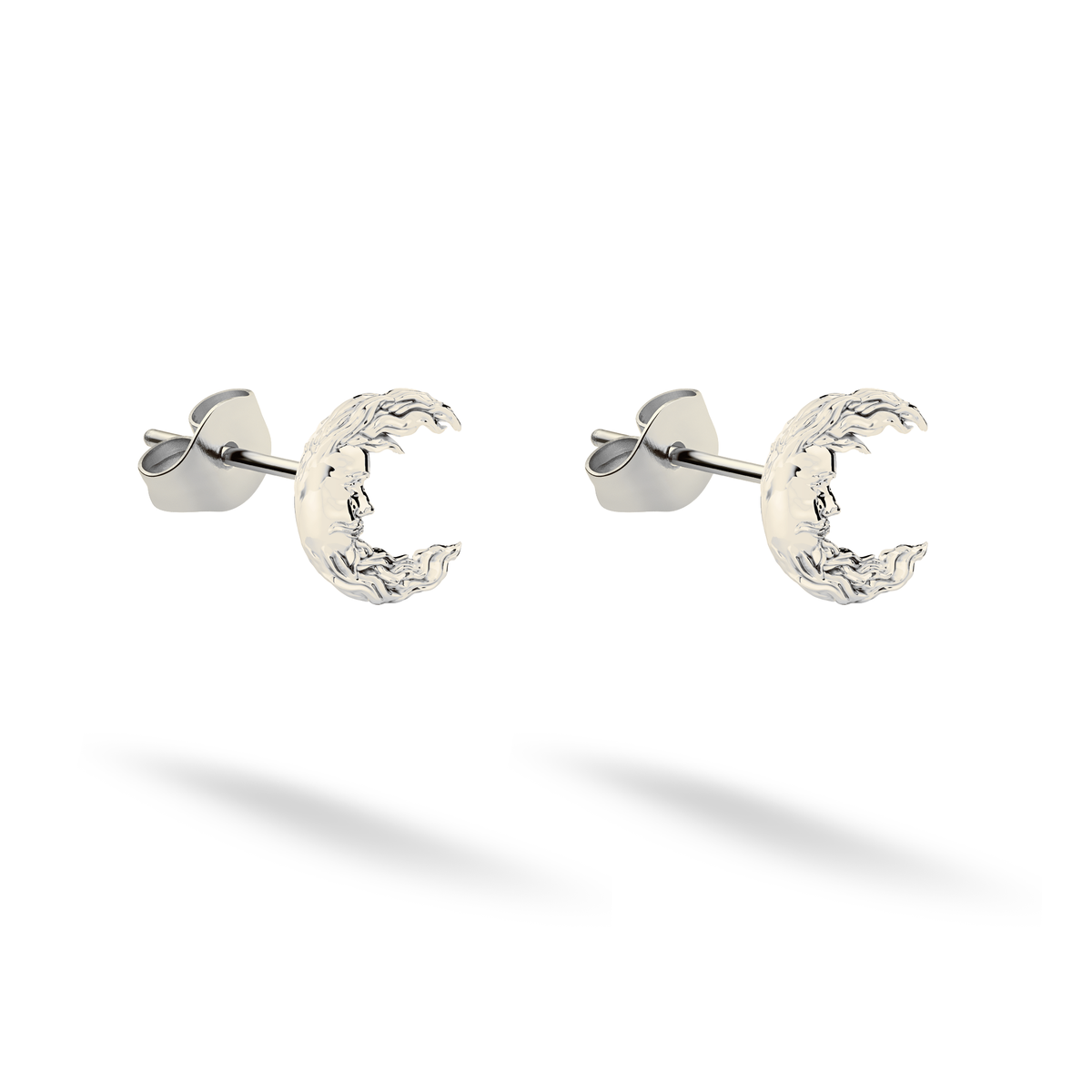 Cool 14K white gold emphasizes the carved face and uneven moon rim