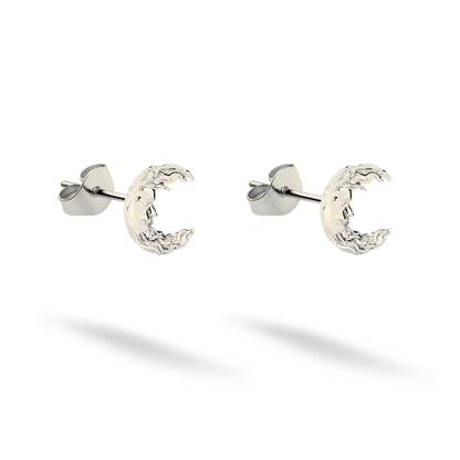 Cool 14K white gold emphasizes the carved face and uneven moon rim