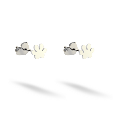 Small paw-shaped studs crafted in crisp 14K white gold on a light background