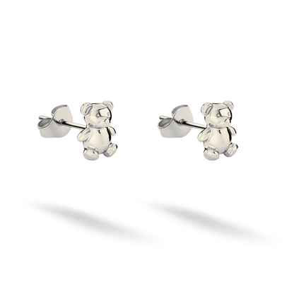 Bright white gold defines the toy bear paws and rounded facial features