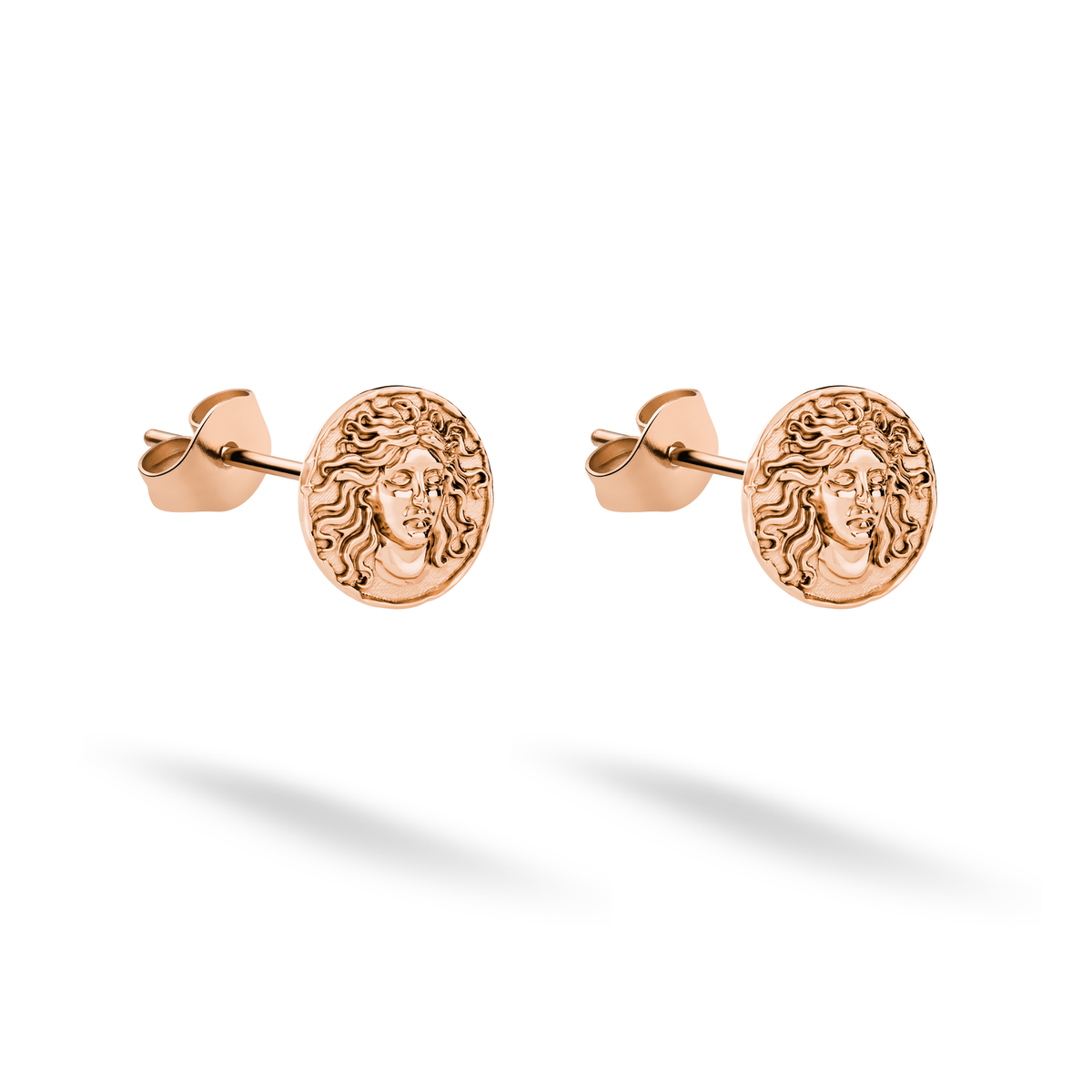 Rose gold lends an antique warmth to the sculpted Medusa face earrings