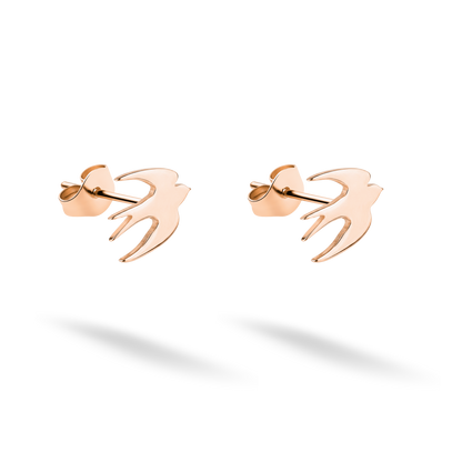 Flying bird studs photographed as a coordinated pair in warm 14K rose gold