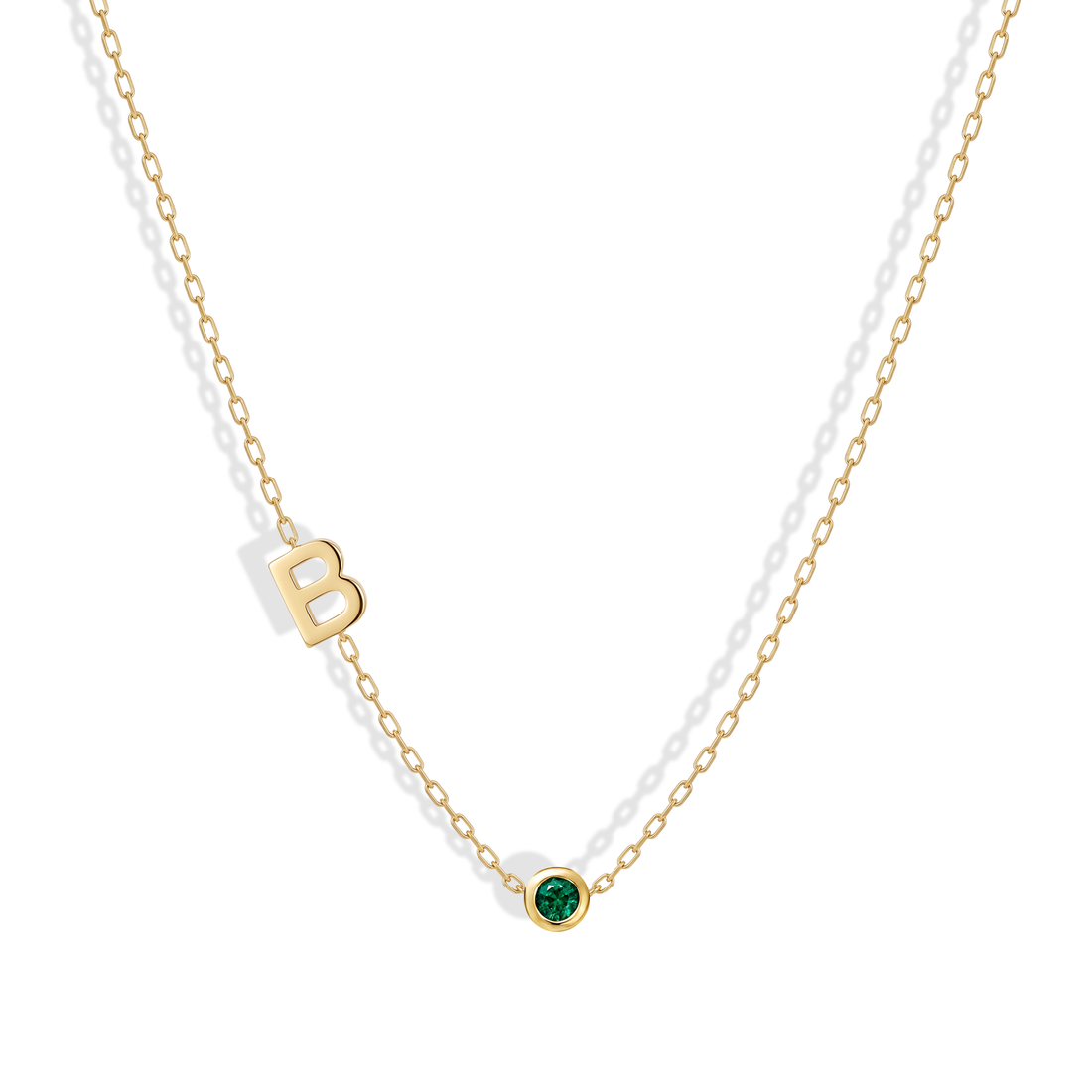 Personalized 14K gold necklace featuring an initial and birthstone charm — a meaningful, elegant piece perfect for gifting or everyday wear.
