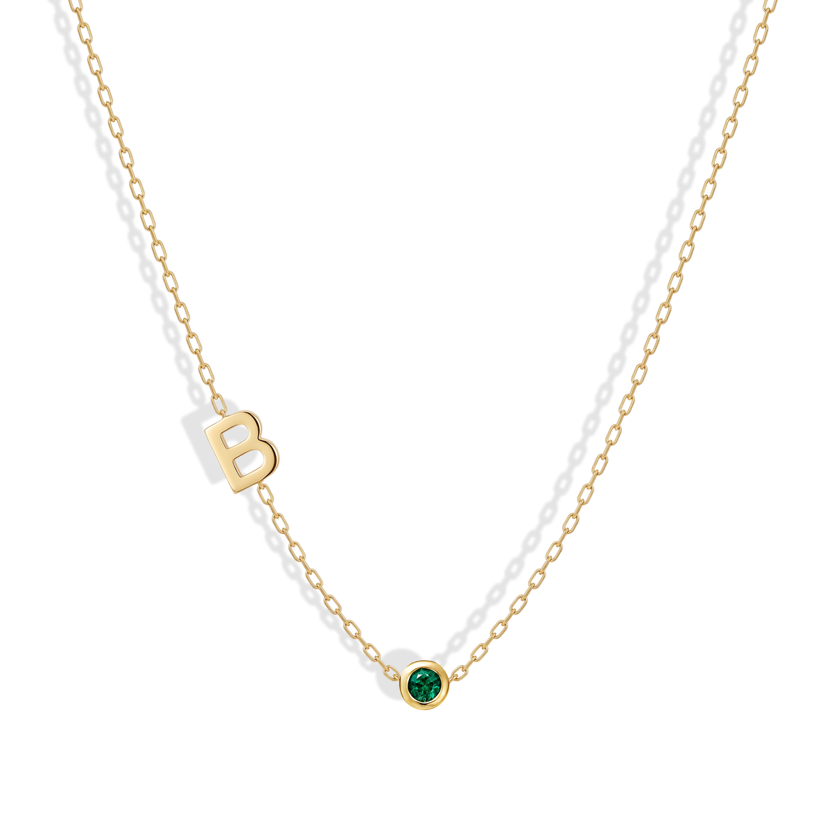 Personalized 14K gold necklace featuring an initial and birthstone charm — a meaningful, elegant piece perfect for gifting or everyday wear.