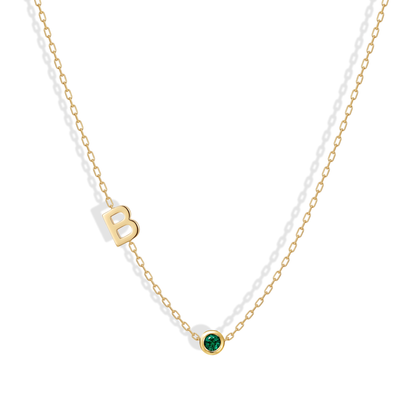 Personalized 14K gold necklace featuring an initial and birthstone charm — a meaningful, elegant piece perfect for gifting or everyday wear.