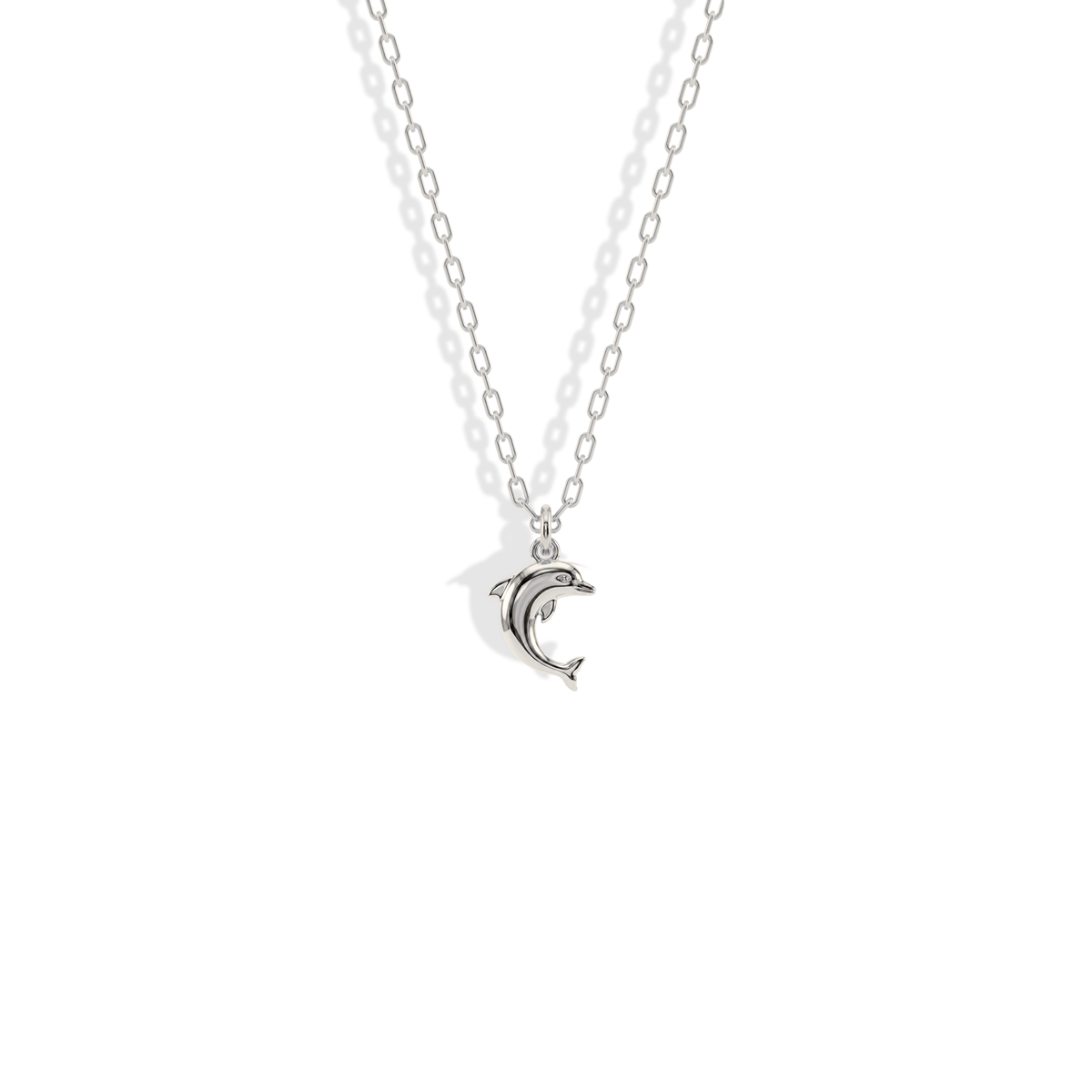 White gold dolphin pendant with a cool, silvery finish that suits stacked chains
