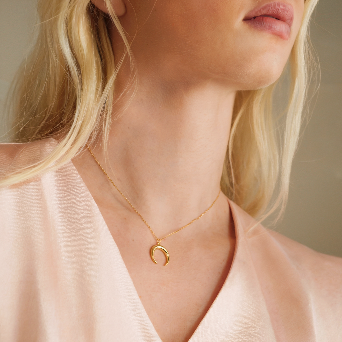 Shine with celestial charm. The Crescent Moon Necklace 14K Gold adds timeless elegance and meaning to your style, symbolizing light and transformation.