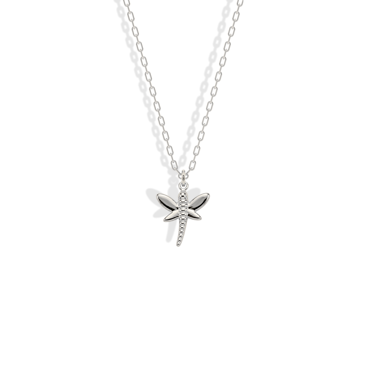 White gold dragonfly with cool reflections defining its segmented body