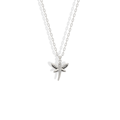 White gold dragonfly with cool reflections defining its segmented body