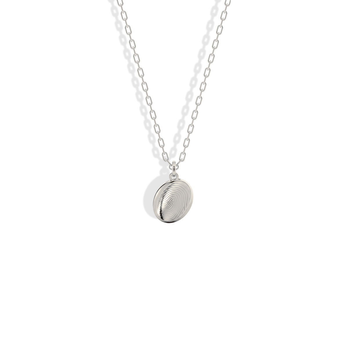 High contrast fingerprint lines on a cool white gold oval