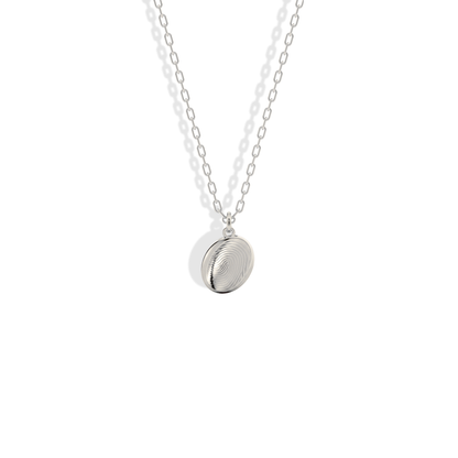 High contrast fingerprint lines on a cool white gold oval