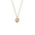 Close studio view of the Fingerprint Oval Custom Necklace 14K Gold / Silver, fingerprint ridges engraved into yellow gold