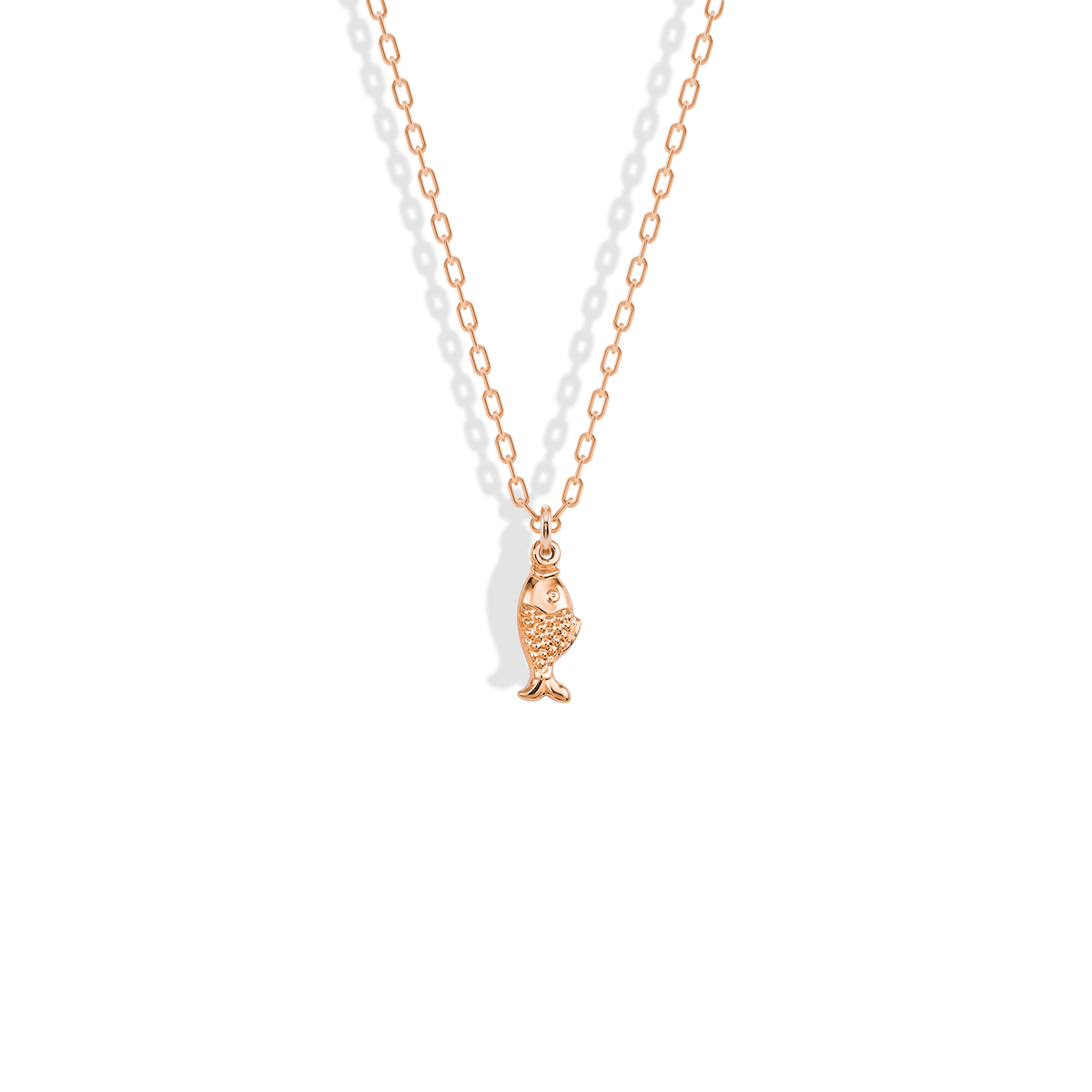 Rose gold fish charm, the pink tone warming the scale detail