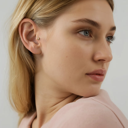 Portrait styling pairs the faceted rabbit flatback with a clean, playful ear arrangement.
