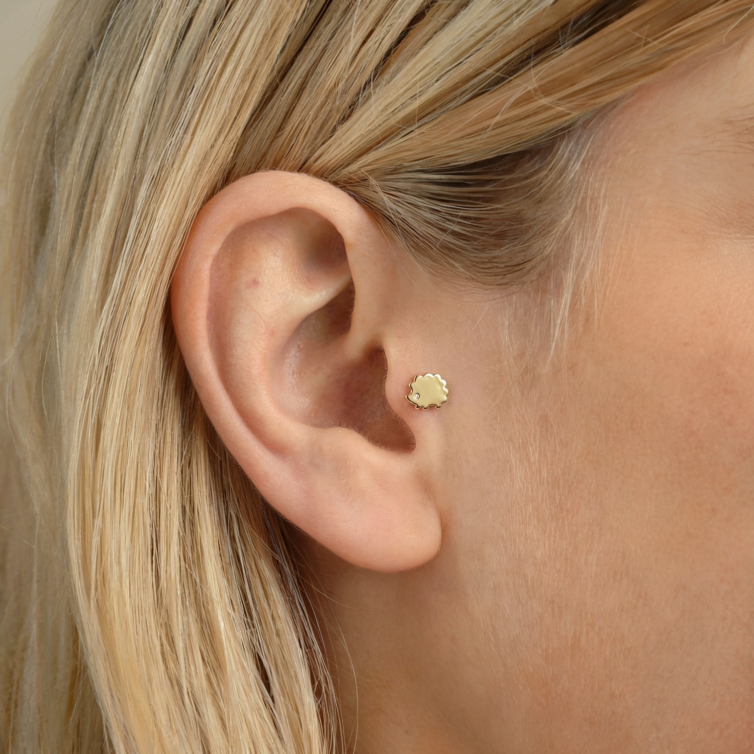 Cute hedgehog piercing in 14K gold or silver with a comfortable flatback design. A charming, hand crafted piece for everyday wear.