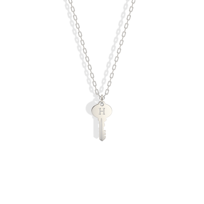Bright, cool 14K white gold version of the key initial necklace, close in look to polished silver