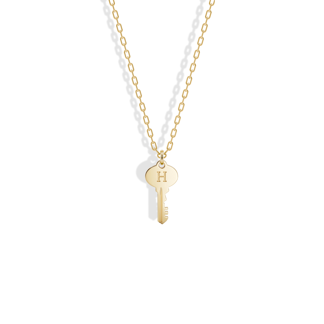 Key Initial Letter Custom Pendant Necklace 14K Gold / Silver, the yellow gold key with a letter engraved on its oval bow