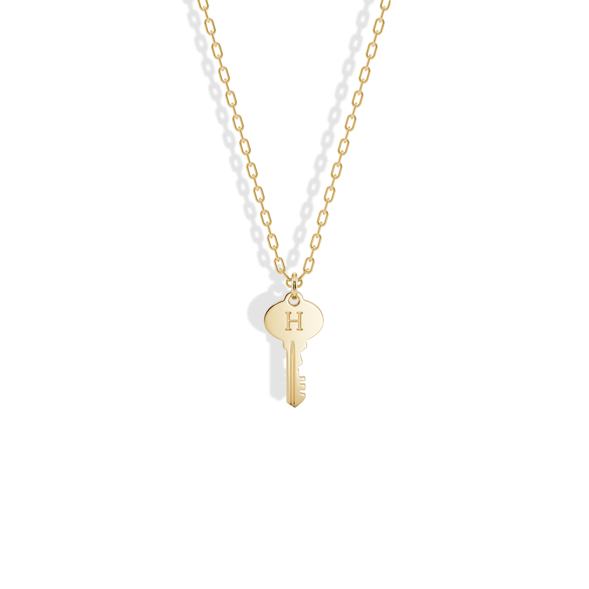 Key Initial Letter Custom Pendant Necklace 14K Gold / Silver, the yellow gold key with a letter engraved on its oval bow
