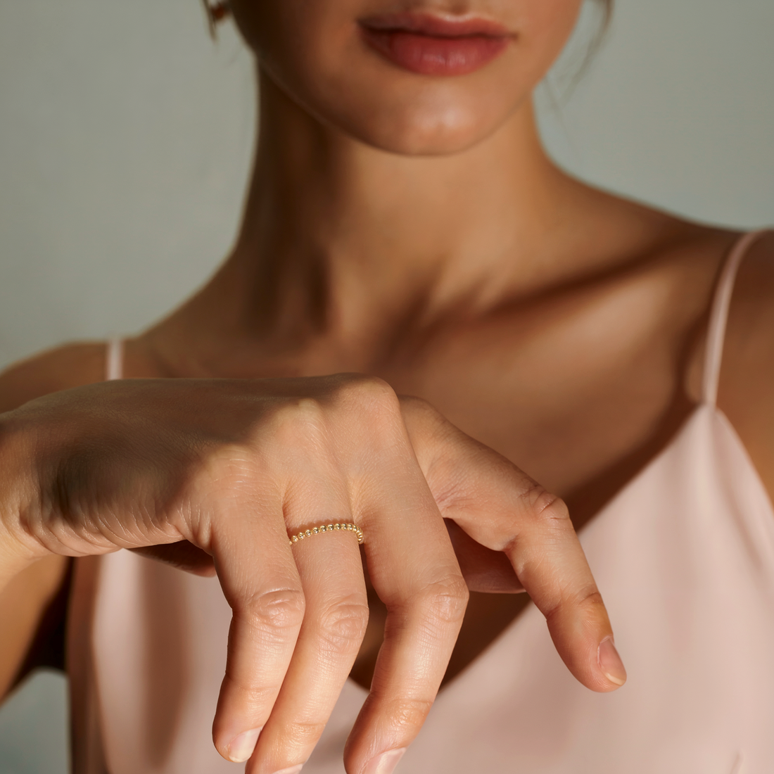 Minimalist Beaded Band Ring 14K Gold with delicate bead detailing on a smooth gold band.