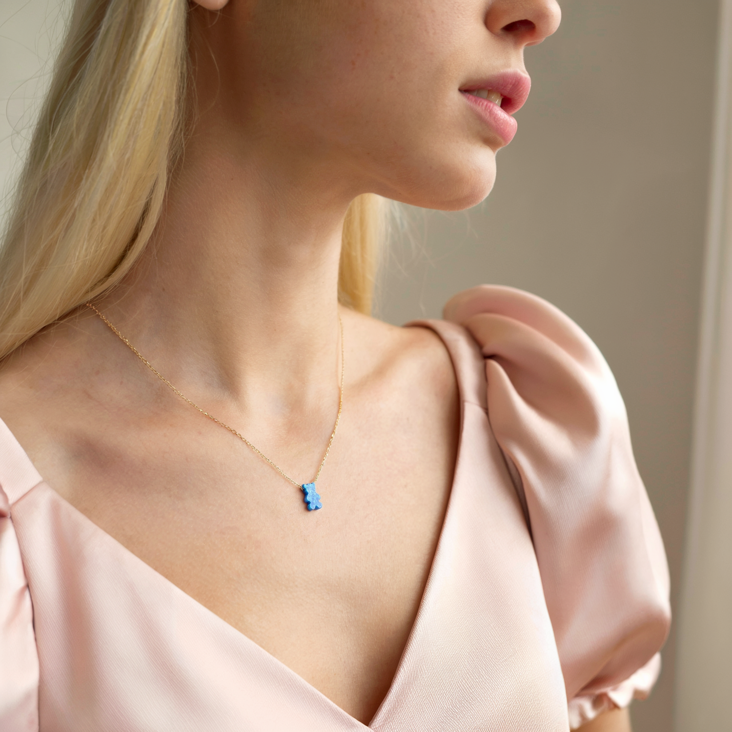 Close-up view of Opal Teddy Bear Necklace 14K Gold / Silver, little bear necklace for kids and animal jewelry lovers