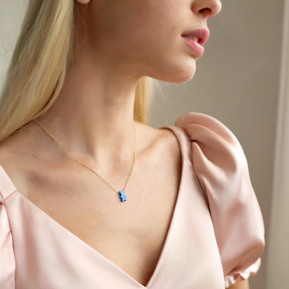 Close-up view of Opal Teddy Bear Necklace 14K Gold / Silver, little bear necklace for kids and animal jewelry lovers