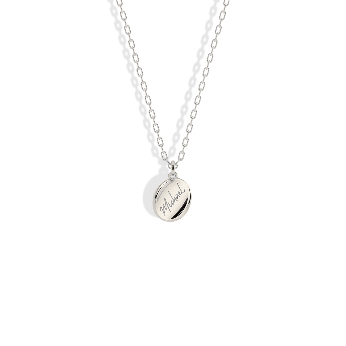 Engraved name pendant in 14K white gold, giving the script a sharper, modern feel
