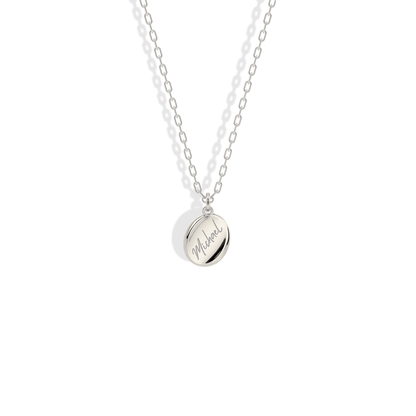 Engraved name pendant in 14K white gold, giving the script a sharper, modern feel