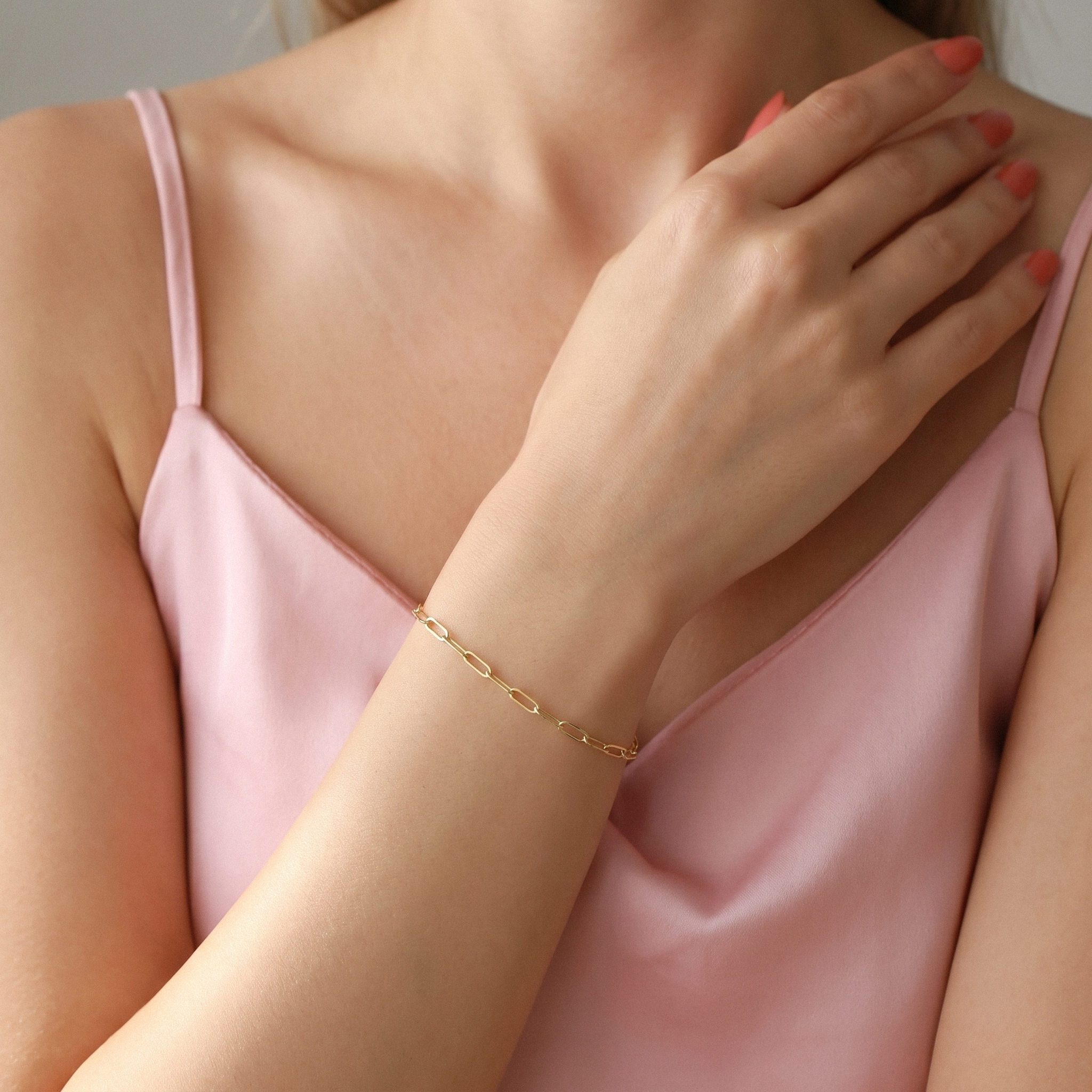Shop a 14K gold paperclip bracelet with modern chain links. 