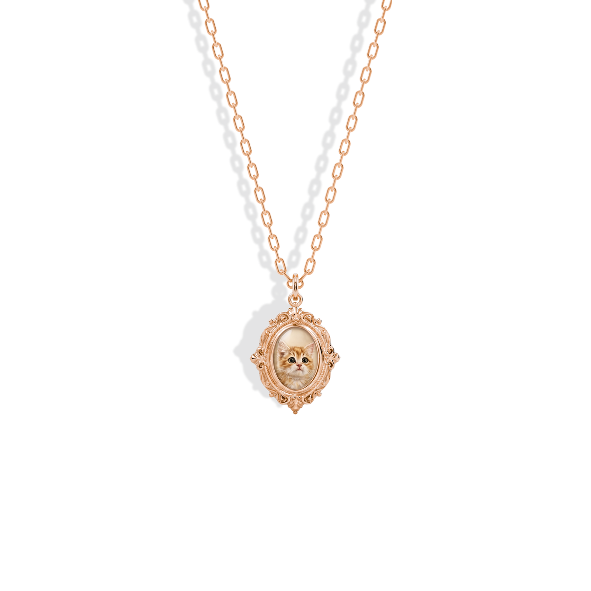 Ornate photo locket in 14K rose gold, a warm border around the enamelled portrait