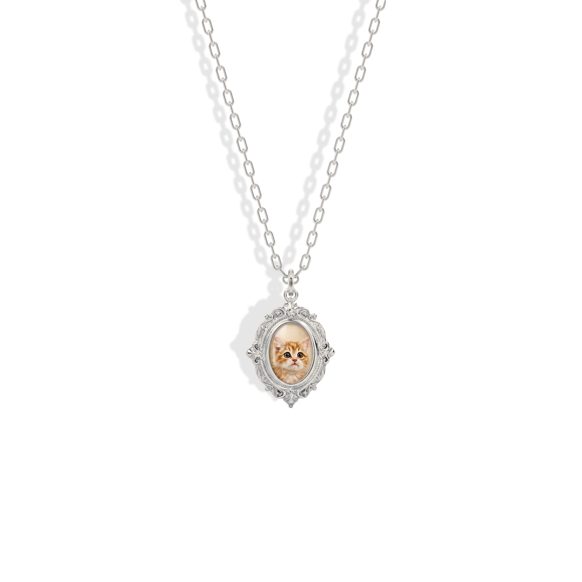 Antique locket feel in cool 14K white gold, the photo framed by pale metal