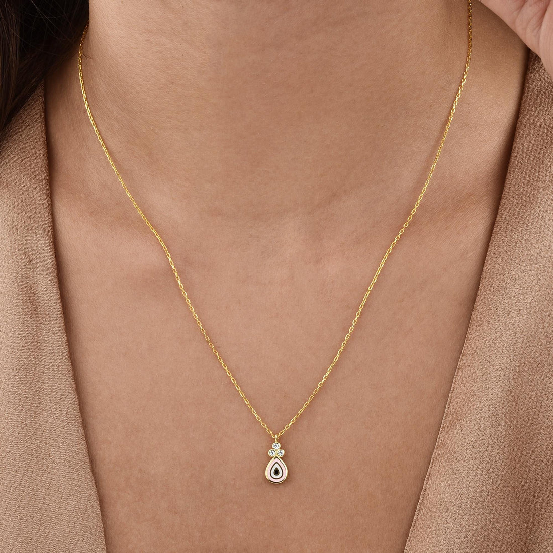 Model wearing the Pink Drop Eyes Diamond Necklace, highlighting its delicate color and symbolic design.