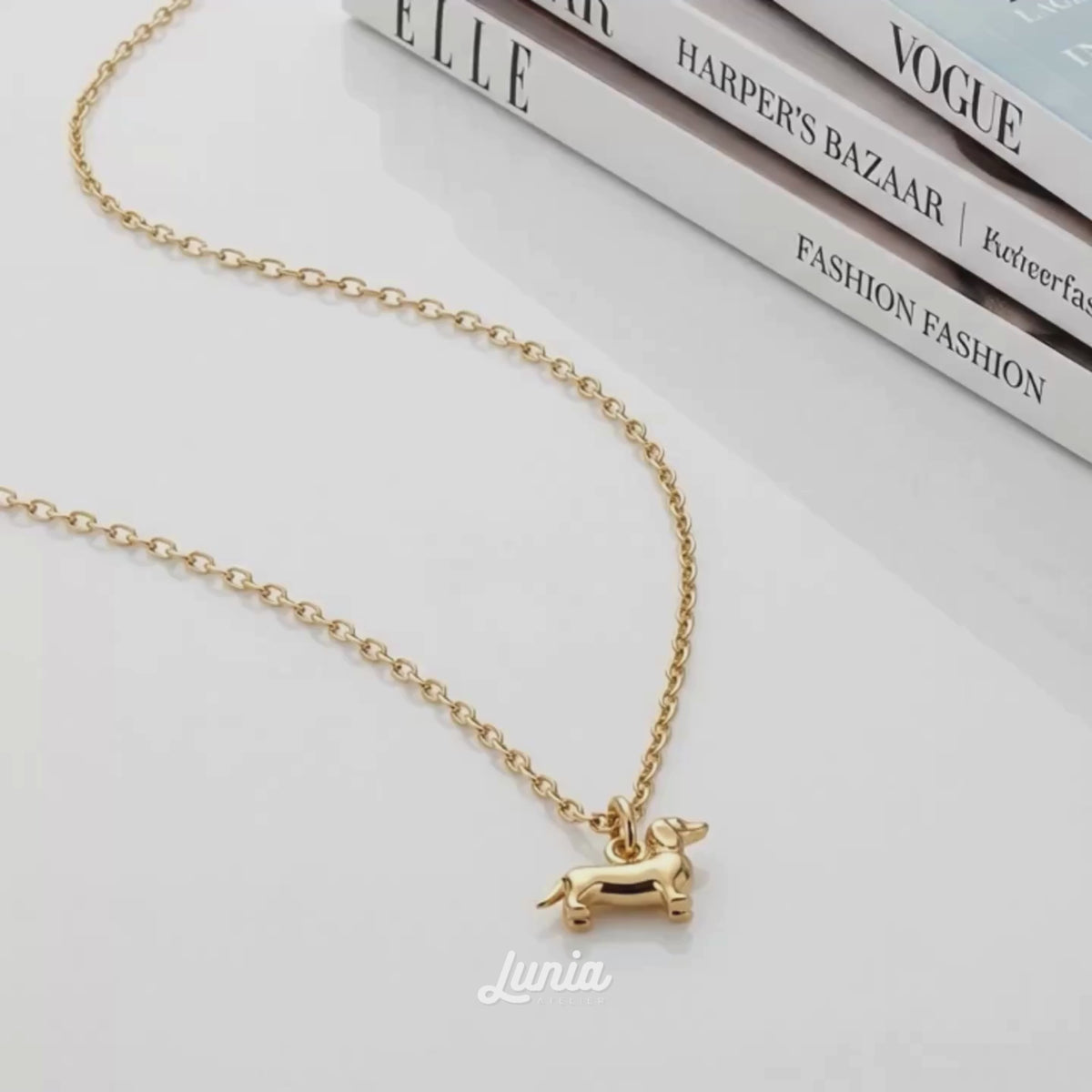 Dachshund Sausage Dog Pendant Necklace in 14K solid gold shown in a short product video