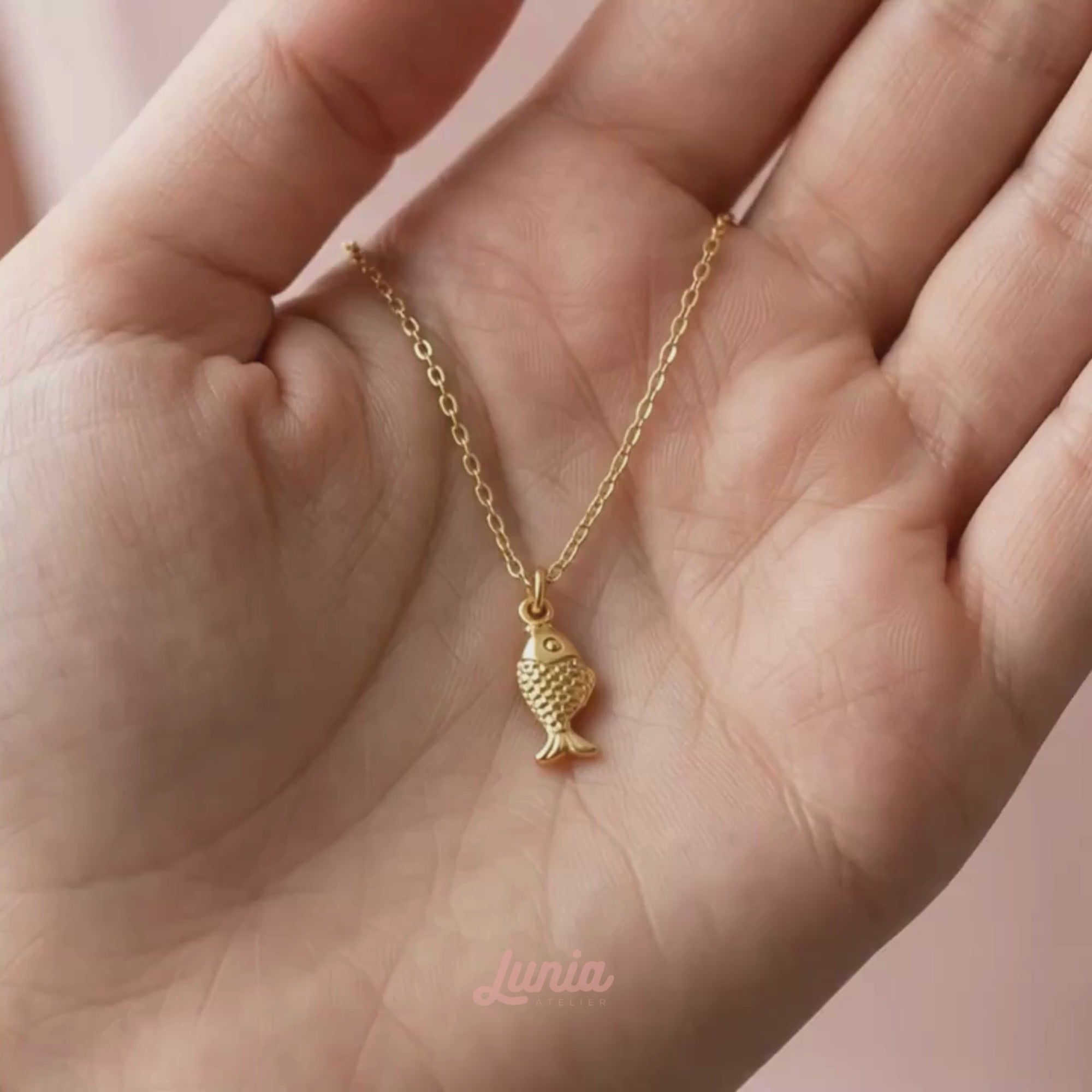 Fish Pendant Necklace 14K Gold shown in motion