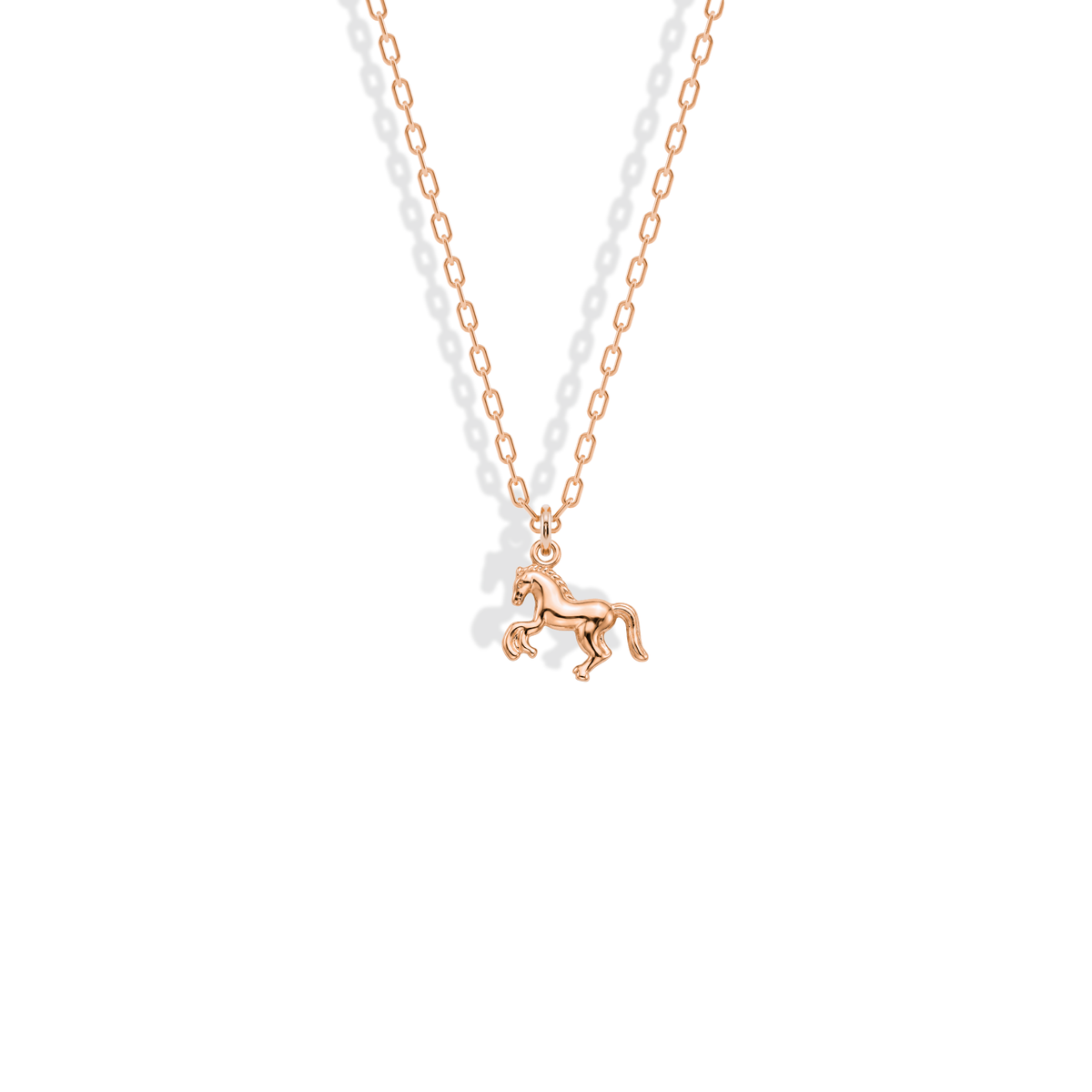 Rose gold gives the rearing horse a warm copper-toned mane and outline