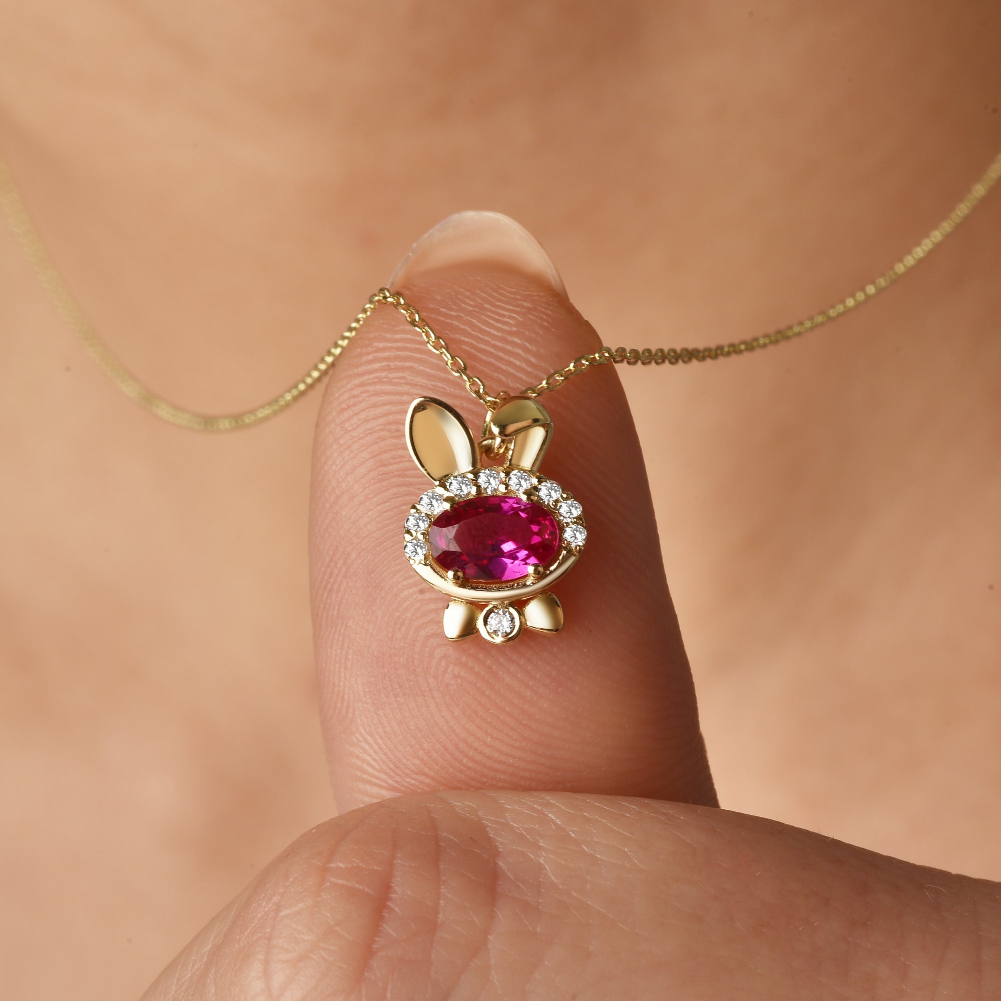 Close-up of Rubby Jewelry bunny necklace featuring bow tie rabbit design and Rubby minimalist style