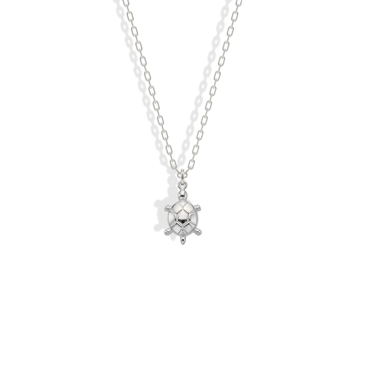 Sea turtle in white gold, a cooler finish suited to silver-toned layers