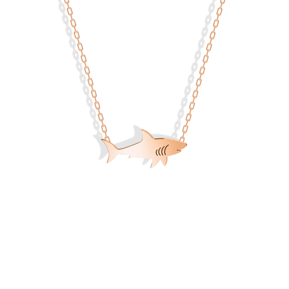 Rose gold shark with a warm reflective line along its back and tail