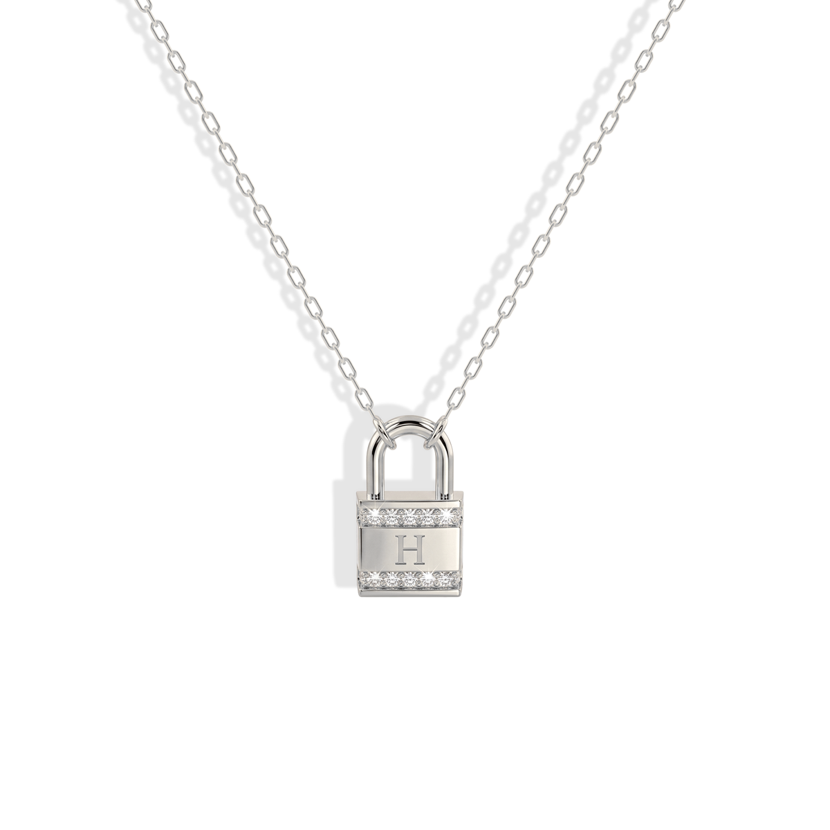 A white gold setting on the lettered padlock makes every stone look brighter